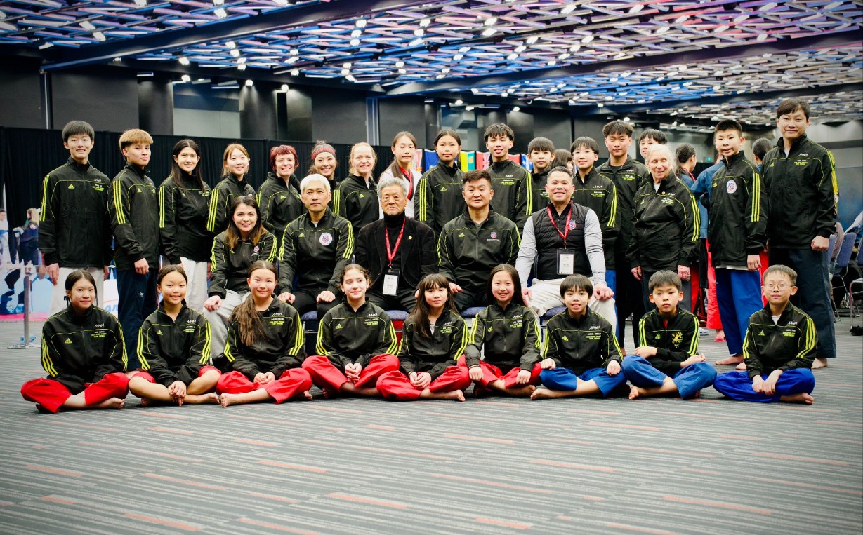 ELITE Poomsae team performing a synchronized form